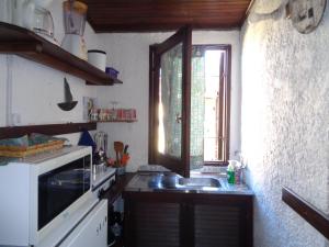 a kitchen with a sink and a window at Francais in La Paloma