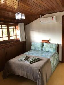 Postel nebo postele na pokoji v ubytování Duplex Borges De Medeiros