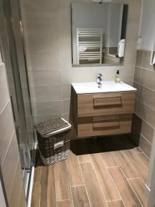 a bathroom with a sink and a mirror at GITE DE FRANCE "A l'essentiel" in Sidiailles