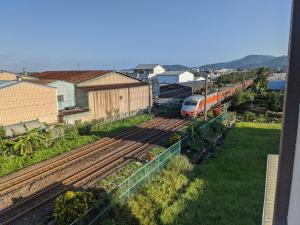 a train is on the tracks in a city at LanCheng Le Petit Voy in Dongshan