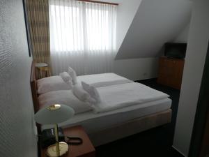 Postel nebo postele na pokoji v ubytování Haus Köbesine