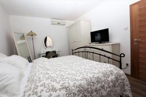 Posteľ alebo postele v izbe v ubytovaní Apartment ARCHIE