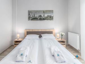 מיטה או מיטות בחדר ב-3L Apartments Diune