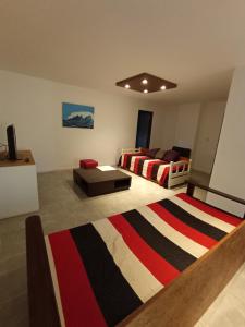מיטה או מיטות בחדר ב-Apartamentos DamianIoele