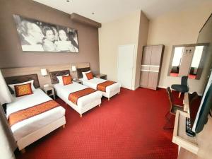 Postel nebo postele na pokoji v ubytování Hotel Washington