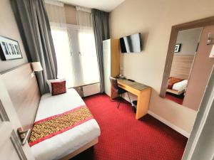 Postel nebo postele na pokoji v ubytování Hotel Washington