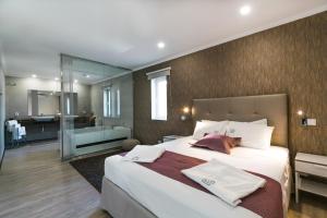 Кровать или кровати в номере EPHYRUS - Country House, Restaurant, Wellness