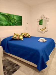A bed or beds in a room at Casa Sauro