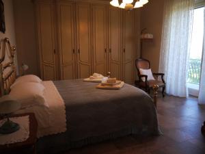 Ένα ή περισσότερα κρεβάτια σε δωμάτιο στο B&B La Collina Dorata