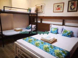 a couple of bunk beds in a room at Casitas Inn Tagaytay Co. in Tagaytay