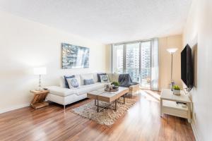 a living room with a white couch and a table at Luxury Miami Condos in Miami Beach