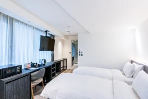 Letto o letti in una camera di RF Hotel - Zhongxiao