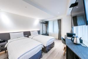 Letto o letti in una camera di RF Hotel - Zhongxiao