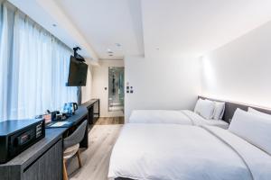 Letto o letti in una camera di RF Hotel - Zhongxiao