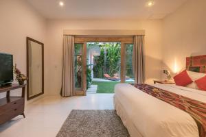 Postel nebo postele na pokoji v ubytování Villa Briana Seminyak by Villas R Us + 32 fotografií