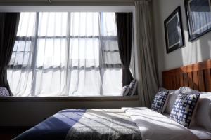 Rúm í herbergi á Dali Yunxi Boutique Inn