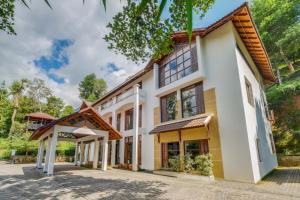 un’immagine di una casa di Southern Panorama Indriya Resorts & Spa a Munnar