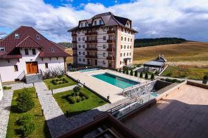 an aerial view of a building and a swimming pool at Adonis Zlatibor 205 in Zlatibor