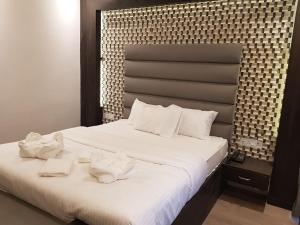 En eller flere senge i et værelse på Hotel Seagull