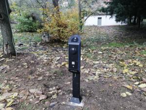 a parking meter in the middle of a field of leaves at Hani Zemenou in Arachova