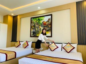 Postel nebo postele na pokoji v ubytování Minh Minh Nam Hotel