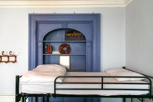 Ένα ή περισσότερα κρεβάτια σε δωμάτιο στο Spoon and the Stars Hostel