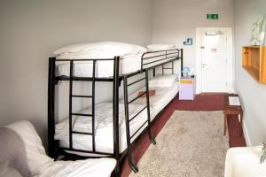 Ένα ή περισσότερα κρεβάτια σε δωμάτιο στο Spoon and the Stars Hostel