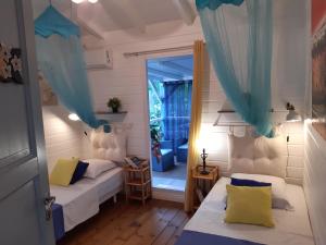 Postel nebo postele na pokoji v ubytování Les Gites Capra - Villa Aiméandre piscine et Spa