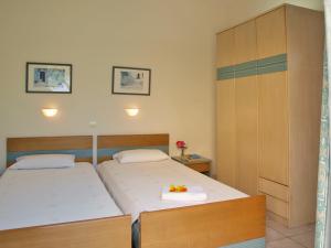 Katil atau katil-katil dalam bilik di Artemis Apartments