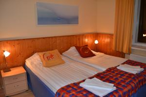 Postel nebo postele na pokoji v ubytování Hotel Utsjoki