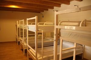 a room with a bunch of bunk beds at Casa Lixa Hotel Rural Albergue in Las Herrerías