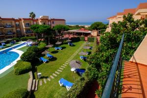 an aerial view of a resort with a swimming pool at Aparthotel las Dunas in Chiclana de la Frontera