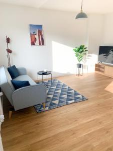 TV a/nebo společenská místnost v ubytování Glück Auf Appartements Lösorter Straße Duisburg