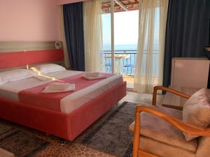 Katil atau katil-katil dalam bilik di Hotel Odhisea Qeparo