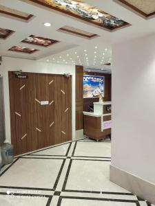 a bathroom with two lockers and a desk in a room at Hotel Ridhi Sidhi Residency in Amritsar