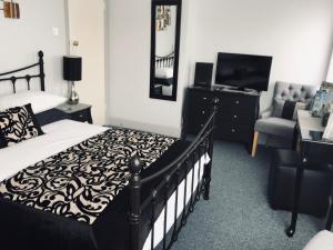 A television and/or entertainment center at Castle Lodge guest house 