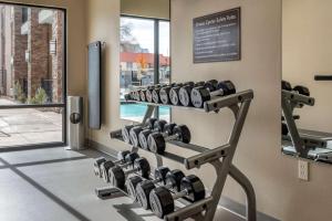 a gym with dumbbells on the wall at Sleep Inn & Suites Moab near Arches National Park in Moab