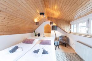 Postel nebo postele na pokoji v ubytování Hotel Porta Nigra