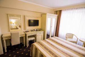 Säng eller sängar i ett rum på Hotel Balada
