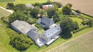 an aerial view of a large house in a field at La grange aux lièvres, gîtes Kerdoel in Cléder