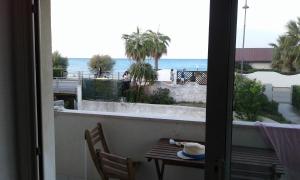 a balcony with a table and a view of the ocean at Casa a 20 metri dal mare! in Fossacesia