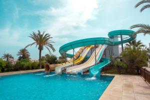a water slide in a pool at a resort at Fiesta Beach Djerba in Midoun