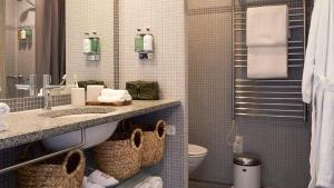 a bathroom with a sink and a toilet at Charlottehaven in Copenhagen +37 photos