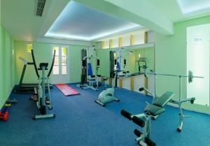 a gym with several treadmills and exercise bikes at Iria Beach Art Hotel in Agia Anna Naxos