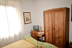 TV a/nebo společenská místnost v ubytování Villa Nencini