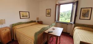 Postel nebo postele na pokoji v ubytování Villa Nencini