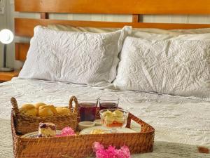 
A bed or beds in a room at Pousada Flor De Canela
