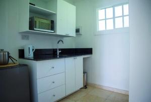 A kitchen or kitchenette at Bequia Plantation Hotel
