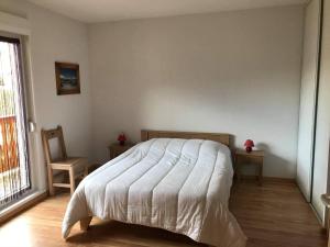 Posteľ alebo postele v izbe v ubytovaní Appartement à la Montagne