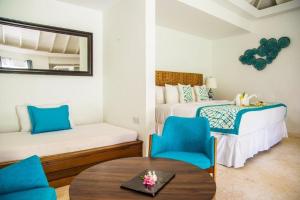 A bed or beds in a room at Bequia Plantation Hotel